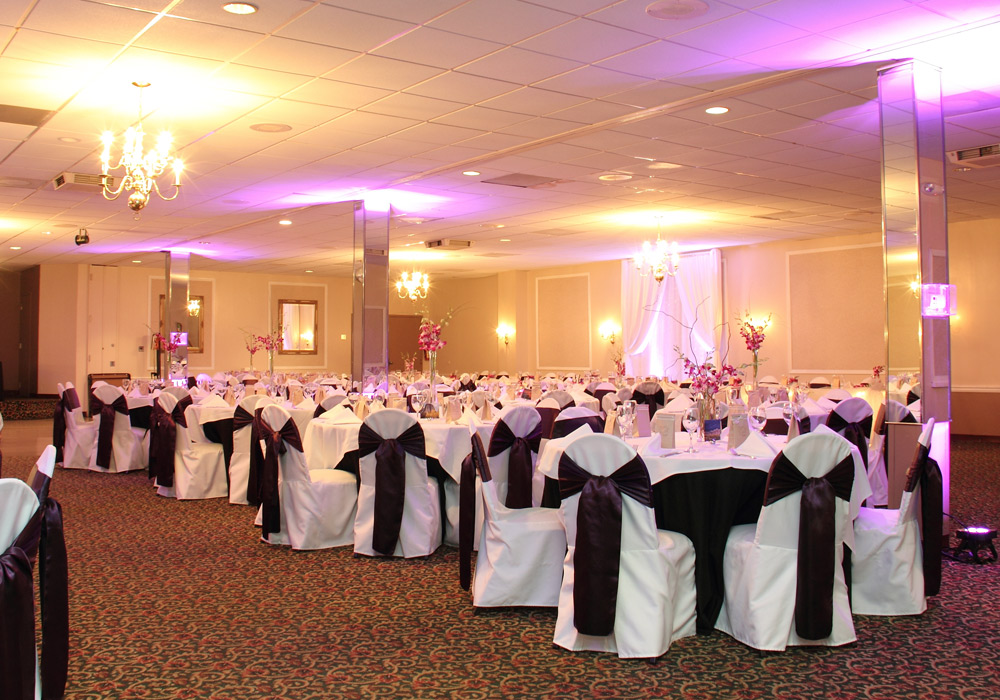 The Christy's O'Fallon banquet room featuring elegantly arranged tables and chairs, ready for an event.